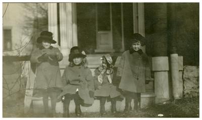 Four unidentified children on a porch