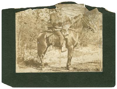 Unidentified man on a horse