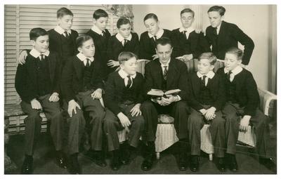 Unidentified man with eleven boys