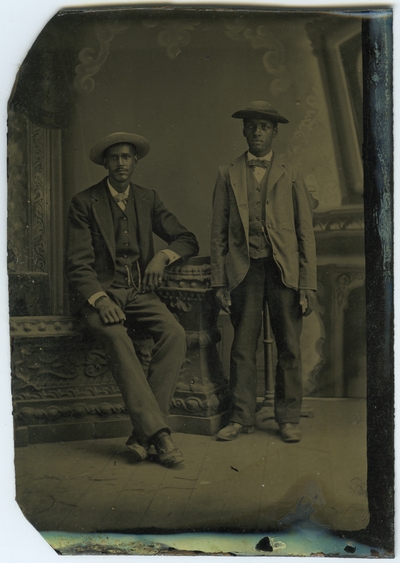 Two unidentified African American males ; photo located on page 16 of album