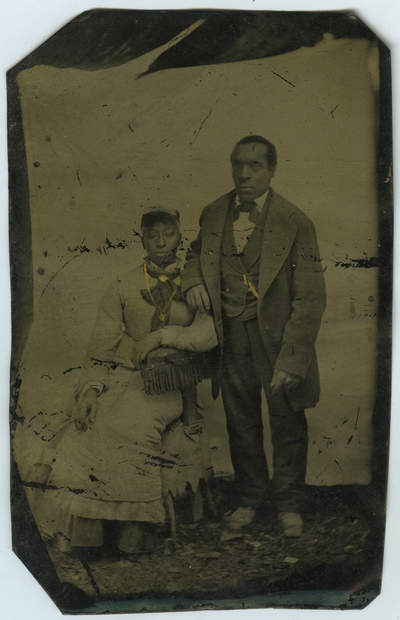 Unidentified African American male and female ; photo located on page 25 of album