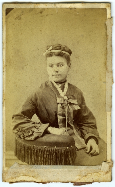 Unidentified African American female ; photo located on page 9 of album