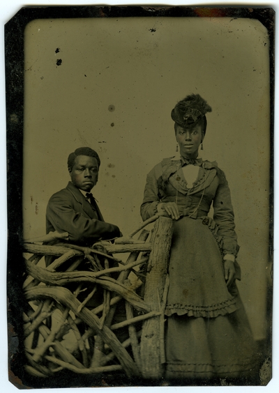 Unidentified African American male and female ; photo located on page 14 of album