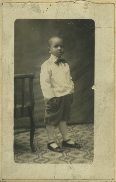 Unidentified African American male child ; photo remains within album and is located on page 30