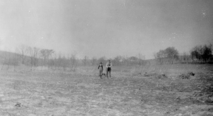 Luther B. Mason (Senior and Junior) standing at site of former salt and sulfur wall in the forks of Grassy Lick Creek. This was the orig. location of the Grassy Lick, which probably included the entire bottom in the forks