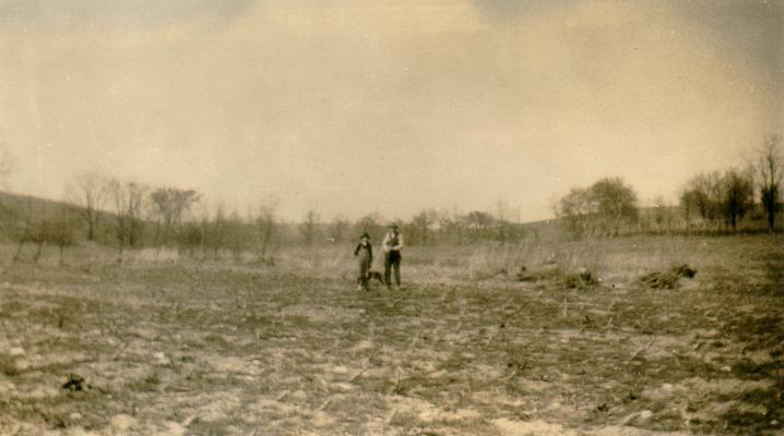Two men in field at Grassy Lick