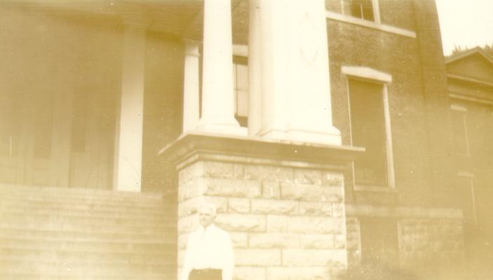 Mr. Wilson in front of building, Hanover College