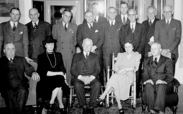 Judge Wilson seated with a group of men and two women