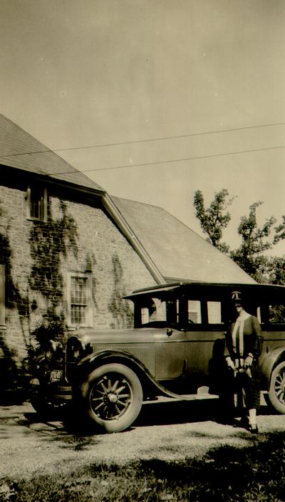 Mary Shelby Wilson next to an automobile