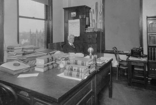 Samuel M. Wilson at his office desk