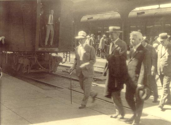 Samuel M. Wilson and other men leaving a railroad station