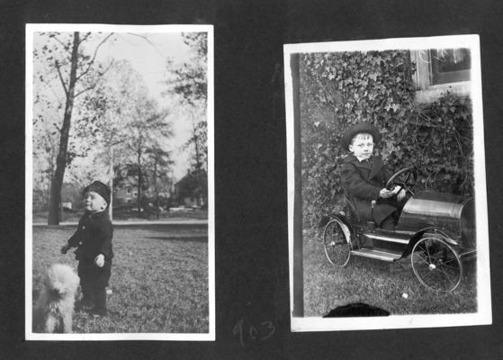 Young boy and a dog; Ned Shelby in a toy car