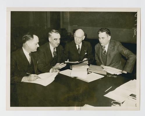 Vinson with members of House Ways & Means Committee, discussing the Vinson-McCormack Bonus Bill. Left to right:  Representative Jere Cooper, Tennessee; Representative Fred M. Vinson, Kentucky; Brigadier General Frank T. Hines, Administrator of Veterans Affairs; and Representative John W. McCormack, Massachusetts