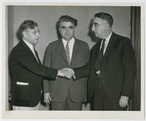 Vinson, right, with Representative Patrick J. Boland, left, and John L. Lewis, center