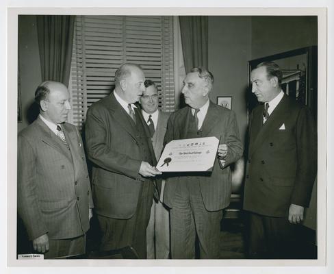 Left to right: Stanley W. Prenosil, US Savings Bonds Division; Emil Schram, New York Stock Exchange; Morris M. Townsend, US Savings Bonds Division; Secretary Vinson; and John A. Coleman, New York Stock Exchange