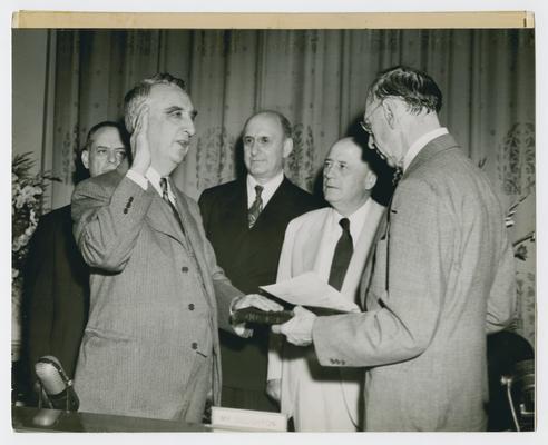 Vinson sworn in as Secretary of the Treasury. Left to right: Representative Jere Cooper of Tennessee; Fred Vinson; Henry Morgenthau, retiring Secretary of Treasury; Sam Rayburn, Speaker of the House of Representatives; and administering the oath, D. Lawrence Groner, Chief Justice of the US Court of Appeals for the District of Columbia