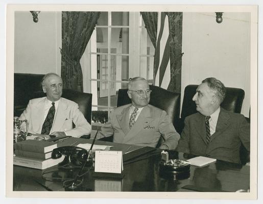 Meeting at White House. Left to right: Secretary of State James F. Byrnes; President Harry S. Truman; and Secretary of the Treasury Vinson