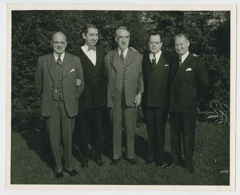Secretary of the Treasury Vinson with Attorney General Tom Clark and C.V. Duke Ridgley and two other men