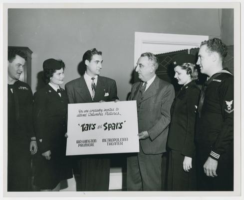 Secretary Vinson with military personnel at premiere of Tars and Spars at the Metropolitan Theater. Pose B