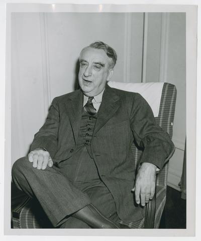 Secretary Vinson seated