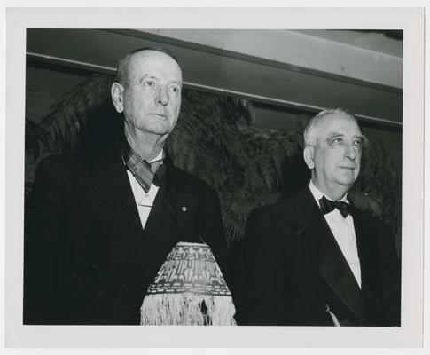 Secretary Vinson, right, with unidentified man