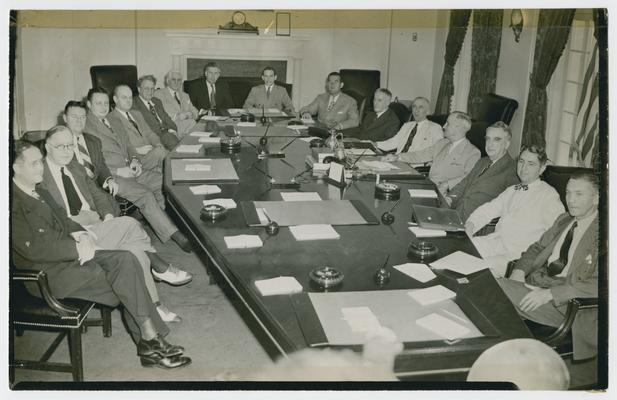 Truman Cabinet, left to right:  Clinton P. Anderson, Secretary of the Agriculture; John B. Blandford, Jr., National Housing Administrator; J.A. Krug, W.P.B. Chairman; John W. Snyder, W.M. Director; William H. Davis, Director Economic Stabilization; Leo Crawley, Foreign Economic Administrator; Henry A. Wallace, Secretary of the Commerce; Abe Fortas, Undersecretary of the Interior; Robert E. Hennegan, Postmaster General; H.L. Stinson, Secretary of War; James F. Byrnes, Secretary of State; Harry S. Truman, President; Treasury Secretary Vinson; Thomas Clark, Attorney General; James Forrestal, Secretary of the Navy
