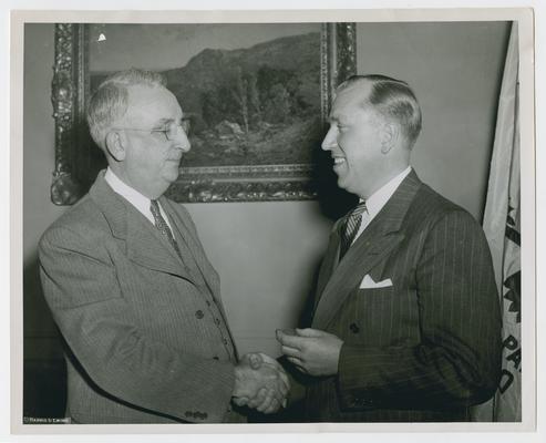 Vinson with E.P. Genock of Paramount News