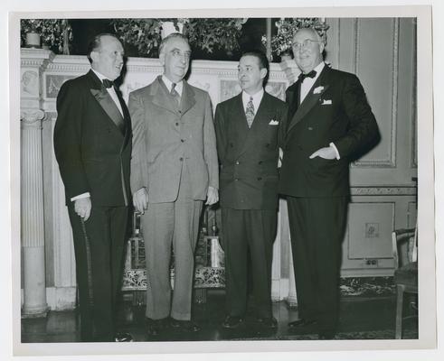 Vinson with three members of the New York County War Bond Committee