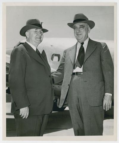 Secretary Vinson with University of Kentucky President Donovan standing near airplane