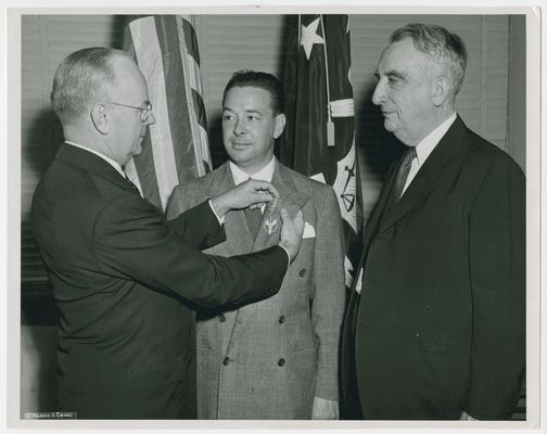 Presentation of Medal of Merit by Secretary of the Treasury Snyder to Ted R. Gamble, with Chief Justice Vinson at right