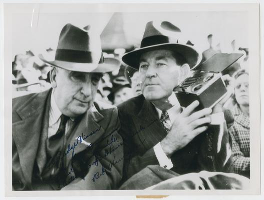 Chief Justice Vinson and Postmaster General Hannegan watch a St. Louis Cardinals baseball game. Inscribed