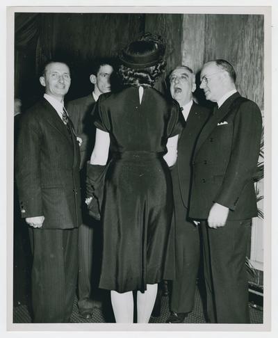 Secretary Vinson and three men greet unidentified woman at Savannah Conference