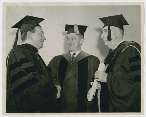 Chief Justice Vinson, with two men, after awarding of degrees at Washington and Lee University