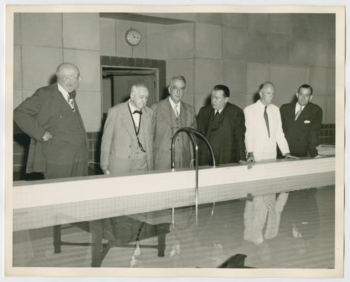 Dedication of Little White House, Warm Springs, Georgia. Behind pool left to right: Homer Cummings, Josephus Daniels, Chief Justice Vinson, Basil O'Connor, Justice Hugo Black, Governor M.E. Thompson. Shot 1