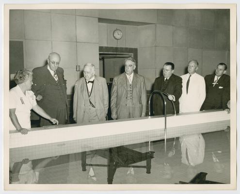 Dedication of Little White House, Warm Springs, Georgia. Behind pool left to right: Homer Cummings, Josephus Daniels, Chief Justice Vinson, Basil O'Connor, Justice Hugo Black, Governor M.E. Thompson. Shot 2