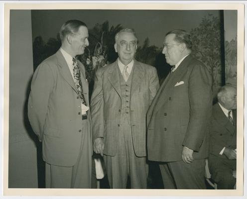 Chief Justice Vinson, center, with Francis Brown, left, and Basil O'Connor, right
