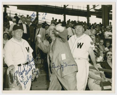 Chief Justice Vinson throws a pitch from the grandstand at the Congressional Baseball Game. Inscribed by Vinson and one unidentified player