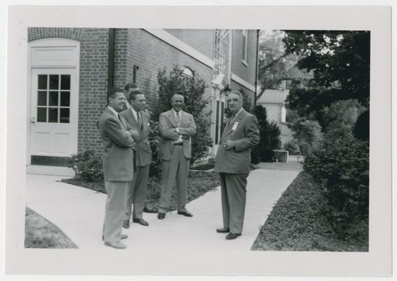 Chief Justice Vinson stands with others in front of Phi Delta Theta Headquarters, Oxford, Ohio