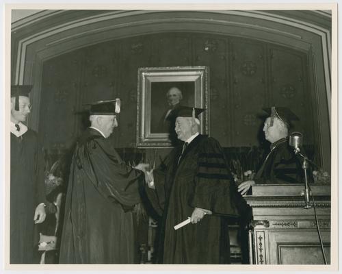Chief Justice Vinson, center left, at Gallaudet College graduation exercises, with Dr. McClure, center, and College President Elstad, right