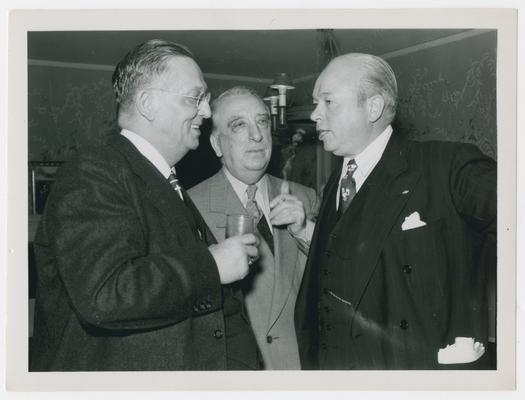 Vinson, center, with two unidentified men
