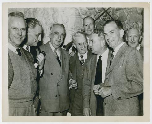 Hog Killin' Party, Warrenton, Virginia. Left to right: Charles N. Murchison, Capital Airlines; Ambassador from France; Chief Justice Vinson; T.J. Wood; Robert Lusk, Benton and Bowles; Charles A. Halleck of Indiana, Minority Leader, House of Representatives, J.W. Fulbright, Senator from Arkansas; Freeman Daniels, Barrister, New York City