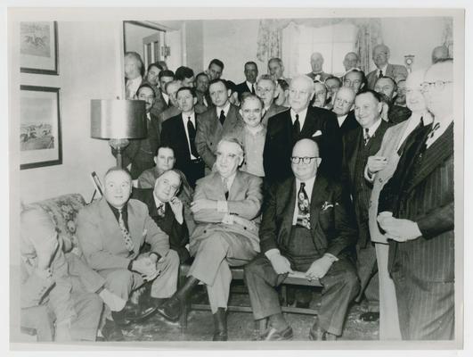 Chief Justice Vinson seated with others