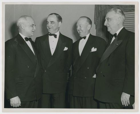 Ruth McCormick Miller's dinner for Dean Manion of Notre Dame. Left to right: Justice Harold H. Burton, Justice Sherman Minton, Dean Manion, and Chief Justice Vinson