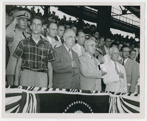 Baseball game at Griffith Stadium. Front row, left to right: James R. Vinson, Chief Justice Vinson, President Truman, and Clark Griffith