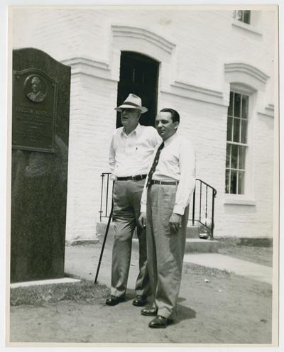 Robert W. Vinson and Bela Kornitzer beside outdoor monument commemorating birthplace of Fred M. Vinson in Louisa, Kentucky