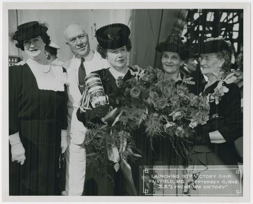 Page 9 of 38, Mrs. Vinson, roses and decorated champagne bottle in hand, with three women and one man