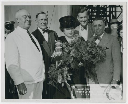 Page 11 of 38, Mrs. Vinson, roses and decorated champagne bottle in hand, with four unidentified men