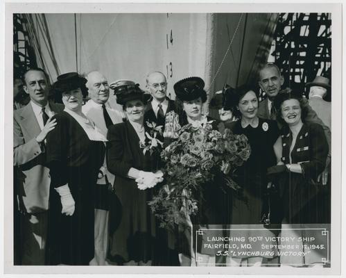 Page 13 of 38, Mrs. Vinson, roses and decorated champagne bottle in hand, with unidentified group