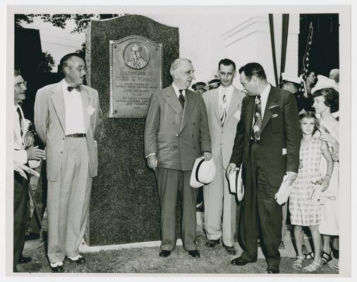 Page 7 of 13, Vinson with second group beside monument commemorating his birthplace in Louisa, Kentucky