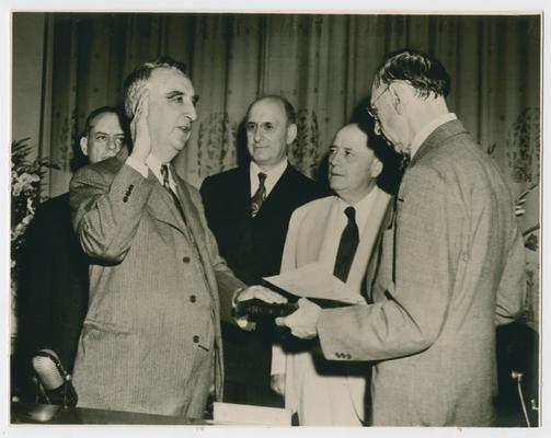 Chief Justice Lawrence Groner swears in Vinson as an associate justice to the US Court of Appeals for the District of Columbia. Sam Rayburn witnesses the ceremony